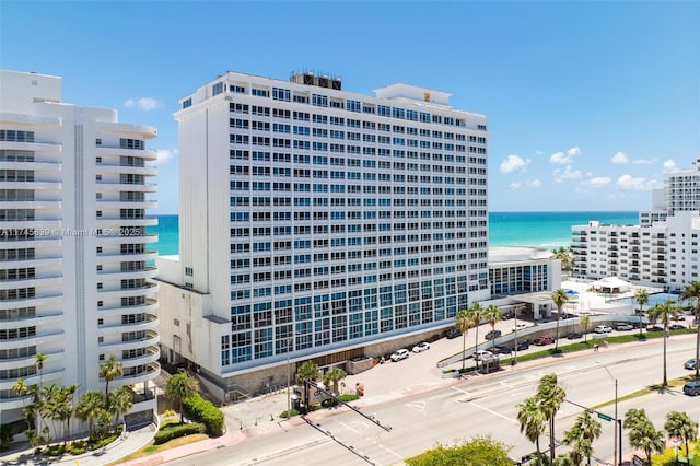 view of building exterior with a water view