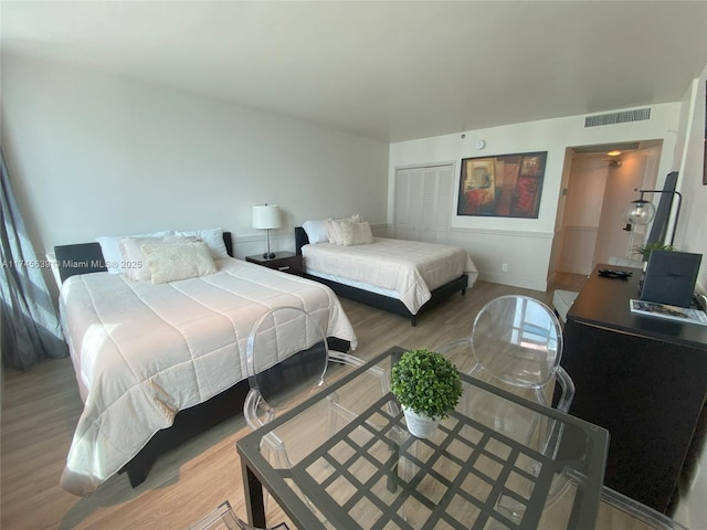 bedroom featuring a closet and hardwood / wood-style floors