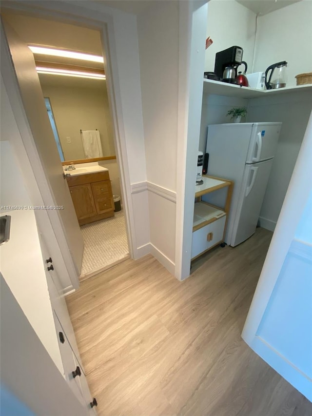 bathroom with wood-type flooring and vanity