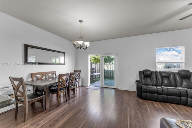 dining area featuring a chandelier and dark hardwood / wood-style flooring