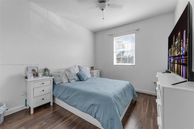 bedroom featuring ceiling fan and dark hardwood / wood-style flooring