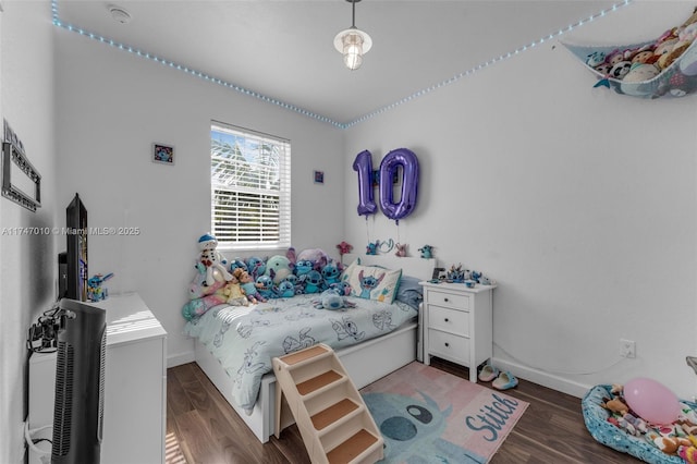 bedroom featuring dark hardwood / wood-style floors