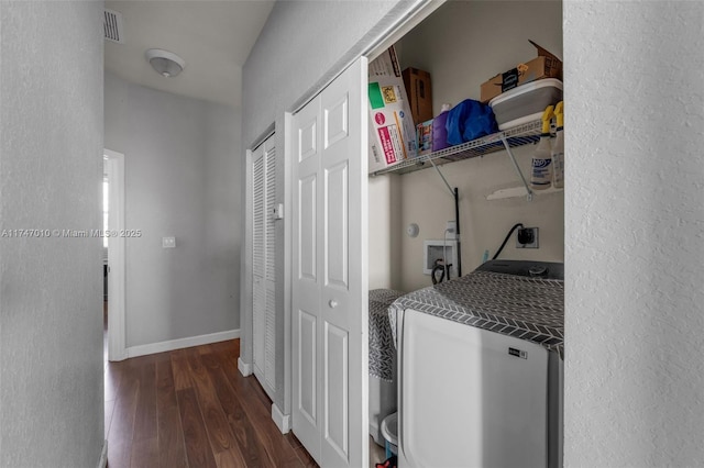 laundry room with hookup for an electric dryer, dark wood-type flooring, and hookup for a washing machine