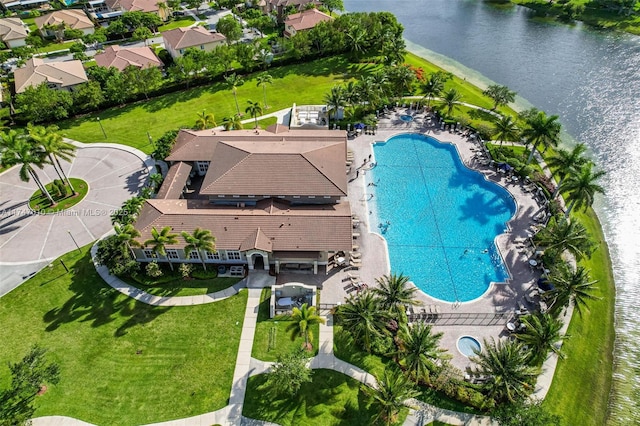 birds eye view of property with a water view