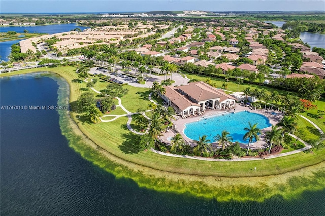 birds eye view of property featuring a water view