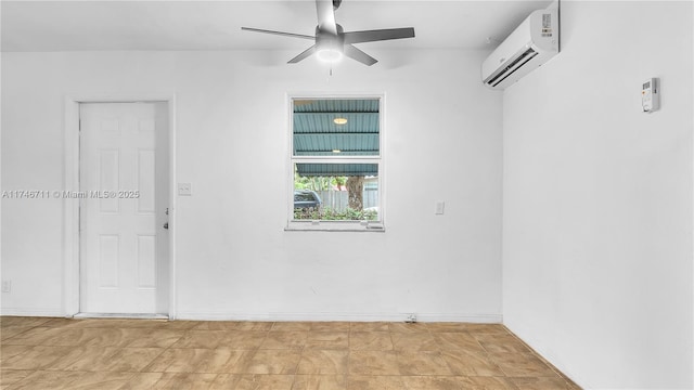 unfurnished room with ceiling fan and a wall unit AC