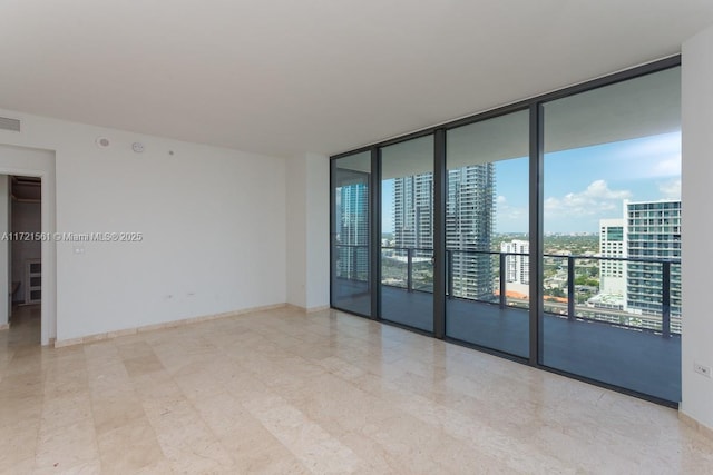 68 SE 6th St Unit 2112, Miami, FL 33131 - unfurnished room featuring floor to ceiling windows