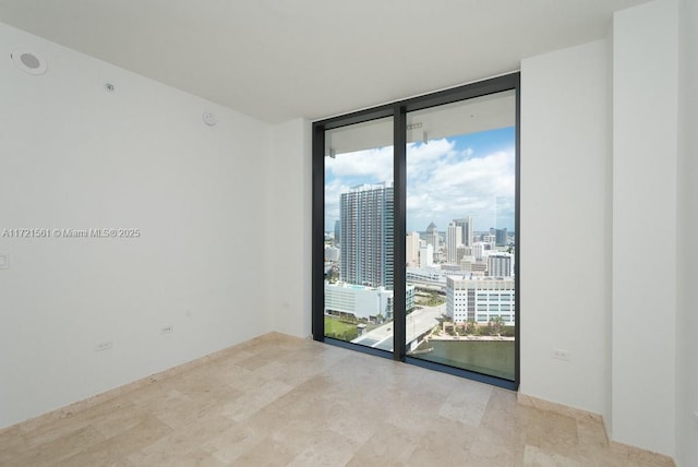 68 SE 6th St Unit 2112, Miami, FL 33131 - unfurnished room featuring a wall of windows and plenty of natural light