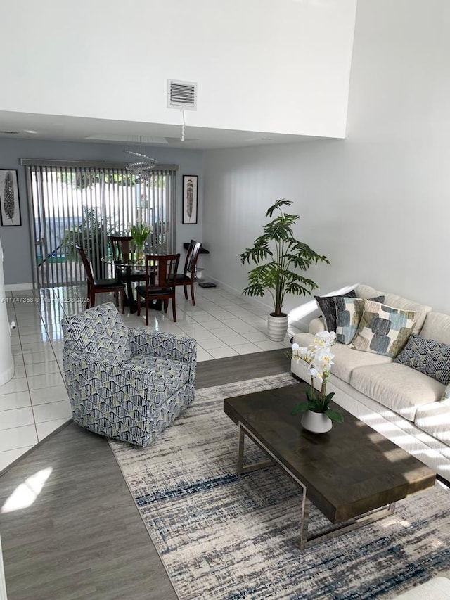 862 NW 132nd Ct, Miami, FL 33182 - living room featuring a high ceiling, visible vents, a chandelier, and tile patterned flooring