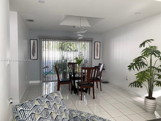 862 NW 132nd Ct, Miami, FL 33182 - dining space with light tile patterned flooring, baseboards, visible vents, and an inviting chandelier