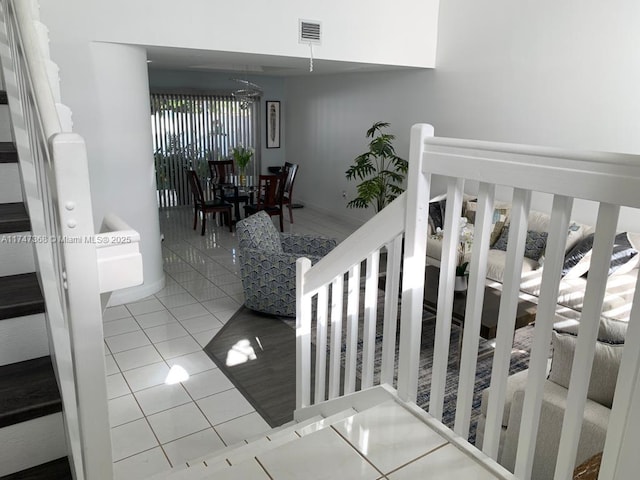 862 NW 132nd Ct, Miami, FL 33182 - stairway with visible vents, tile patterned floors, and a notable chandelier