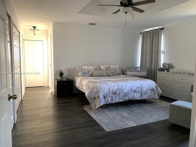 862 NW 132nd Ct, Miami, FL 33182 - bedroom featuring a raised ceiling, visible vents, ceiling fan, and wood finished floors