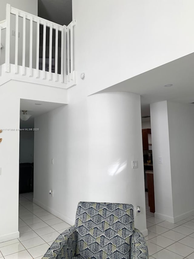 862 NW 132nd Ct, Miami, FL 33182 - stairway featuring a high ceiling, tile patterned floors, and baseboards