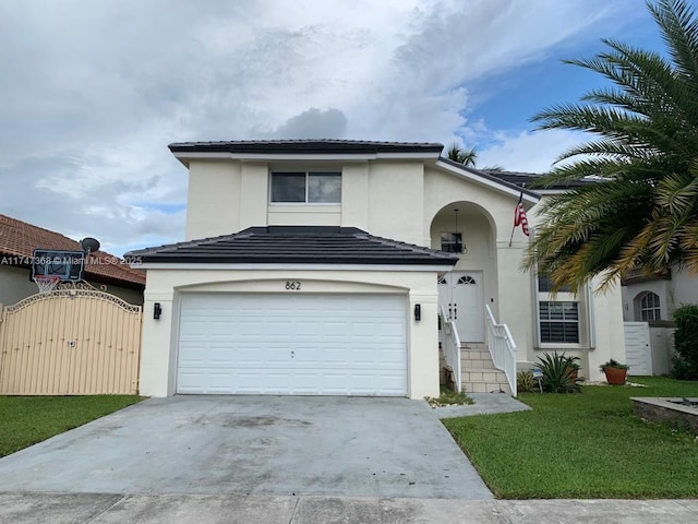 862 NW 132nd Ct, Miami, FL 33182 - view of front of property featuring a tile roof, concrete driveway, stucco siding, an attached garage, and a gate