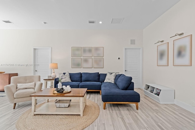 living room with light hardwood / wood-style floors