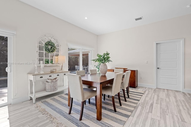 dining space featuring light hardwood / wood-style flooring