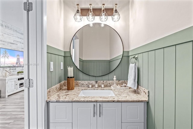 bathroom featuring hardwood / wood-style flooring and vanity