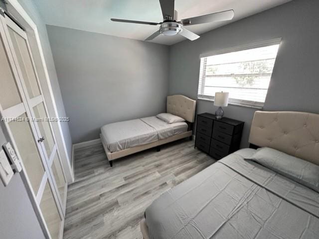 bedroom featuring ceiling fan and light hardwood / wood-style flooring