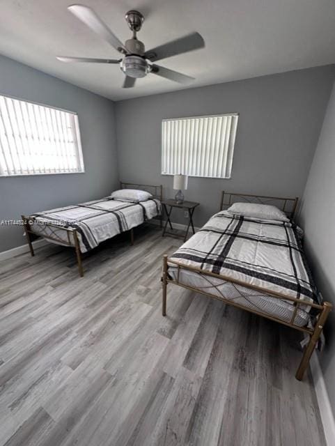 bedroom featuring light hardwood / wood-style flooring and ceiling fan