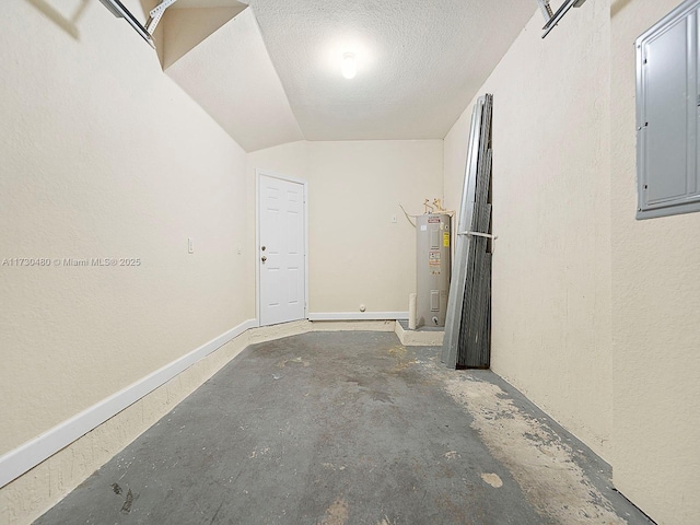 garage featuring water heater and electric panel