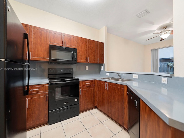 kitchen featuring kitchen peninsula, black appliances, sink, ceiling fan, and light tile patterned floors