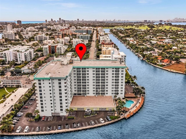 birds eye view of property with a water view