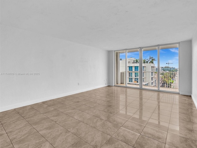 tiled empty room with floor to ceiling windows