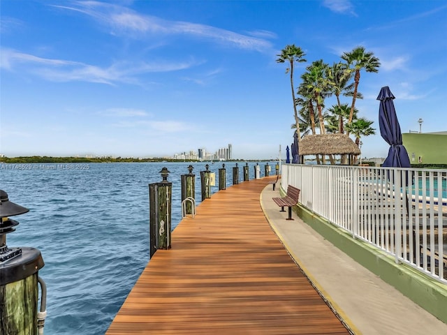 view of dock with a water view and a gazebo