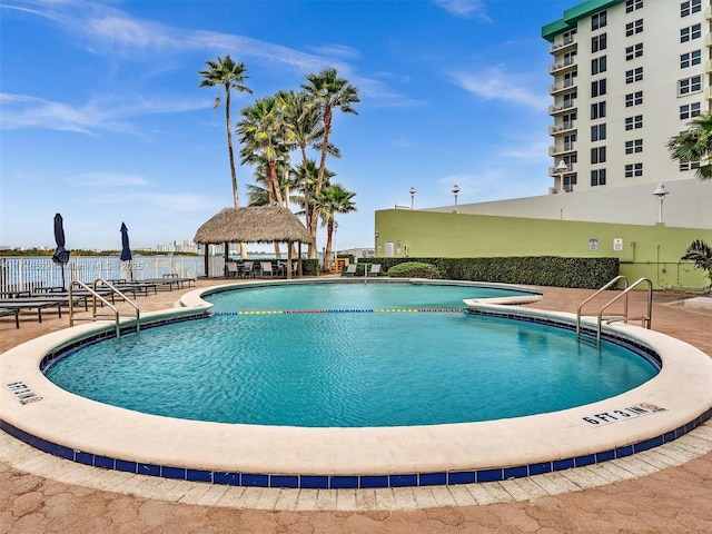 view of swimming pool with a gazebo and a patio area