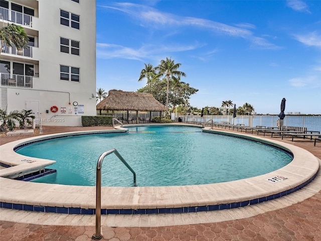 view of pool with a water view and a gazebo