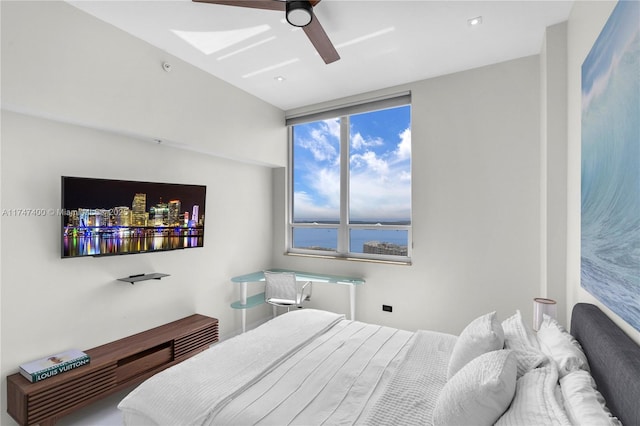 bedroom featuring a water view and ceiling fan