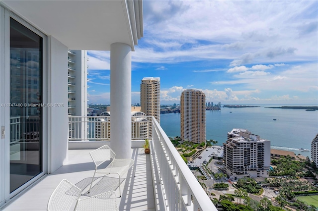 balcony featuring a water view