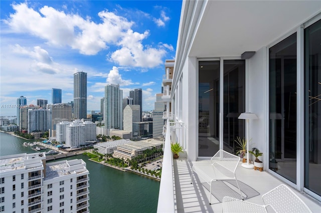 balcony featuring a water view