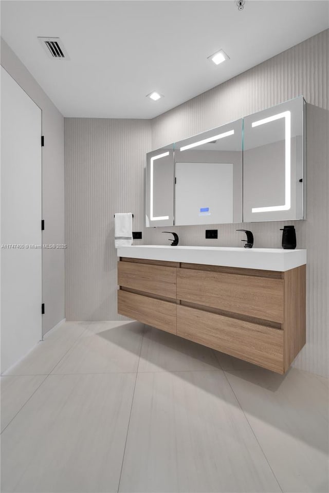 bathroom with vanity and tile patterned flooring