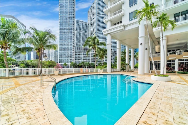 view of swimming pool featuring a patio area