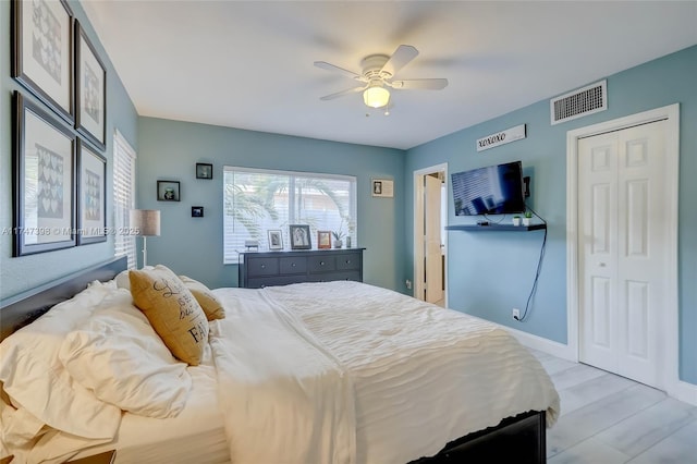 bedroom featuring ceiling fan and light hardwood / wood-style floors