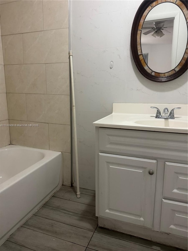 full bath featuring vanity and wood finished floors