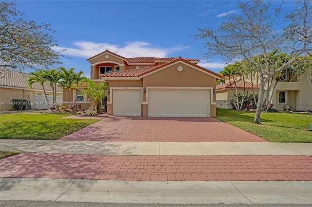 mediterranean / spanish-style home with a front yard