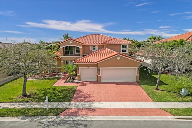 1588 SW 191st Ave, Pembroke Pines, FL 33029 - mediterranean / spanish home featuring stucco siding, decorative driveway, a front lawn, a tile roof, and an attached garage