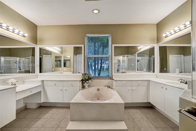1588 SW 191st Ave, Pembroke Pines, FL 33029 - bathroom featuring a sink, two vanities, a shower stall, tile patterned floors, and a garden tub