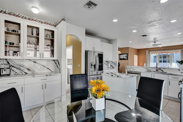 1588 SW 191st Ave, Pembroke Pines, FL 33029 - dining space featuring ceiling fan, washer / clothes dryer, arched walkways, visible vents, and recessed lighting