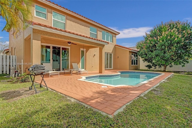 1588 SW 191st Ave, Pembroke Pines, FL 33029 - rear view of house featuring a patio, stucco siding, a ceiling fan, a yard, and fence