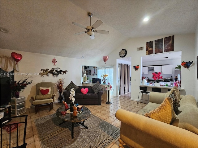 living room featuring light tile patterned flooring, high vaulted ceiling, ceiling fan, and a textured ceiling