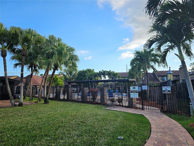 view of home's community with a lawn