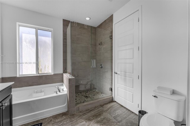 15124 SW 176th Ter, Miami, FL 33187 - bathroom featuring toilet, a stall shower, a bath, and plenty of natural light