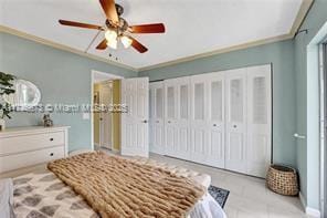 bedroom with a closet, crown molding, and ceiling fan