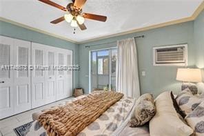 bedroom featuring a ceiling fan, a closet, ornamental molding, and an AC wall unit