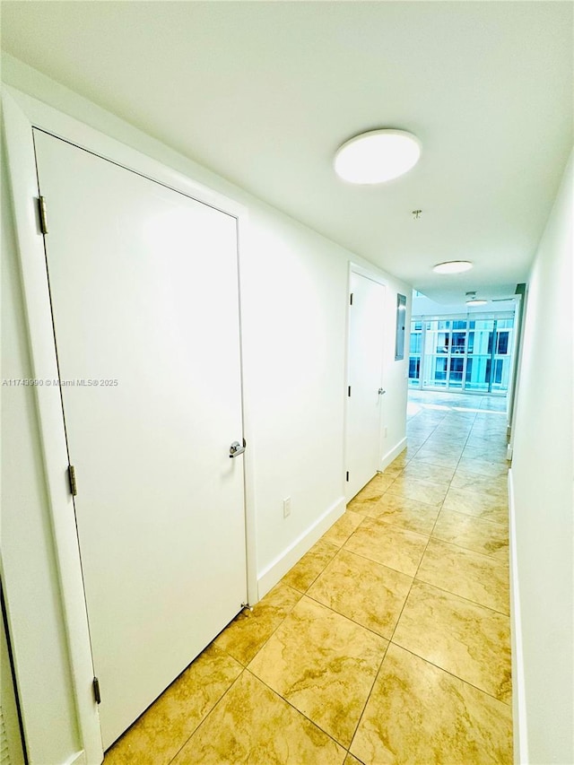 hallway with light tile patterned floors