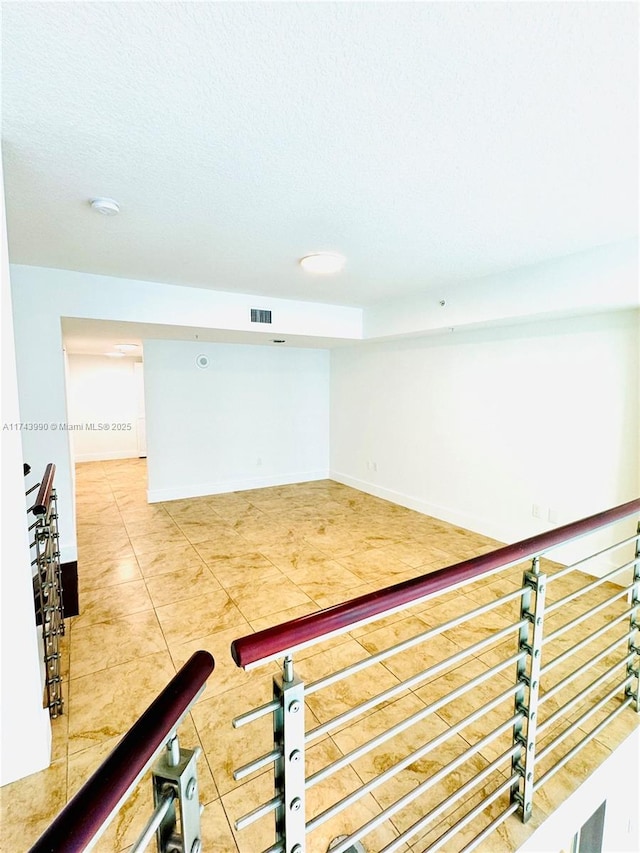 interior space featuring a textured ceiling