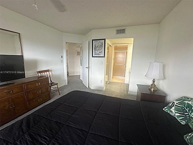 bedroom featuring dark carpet, visible vents, and baseboards